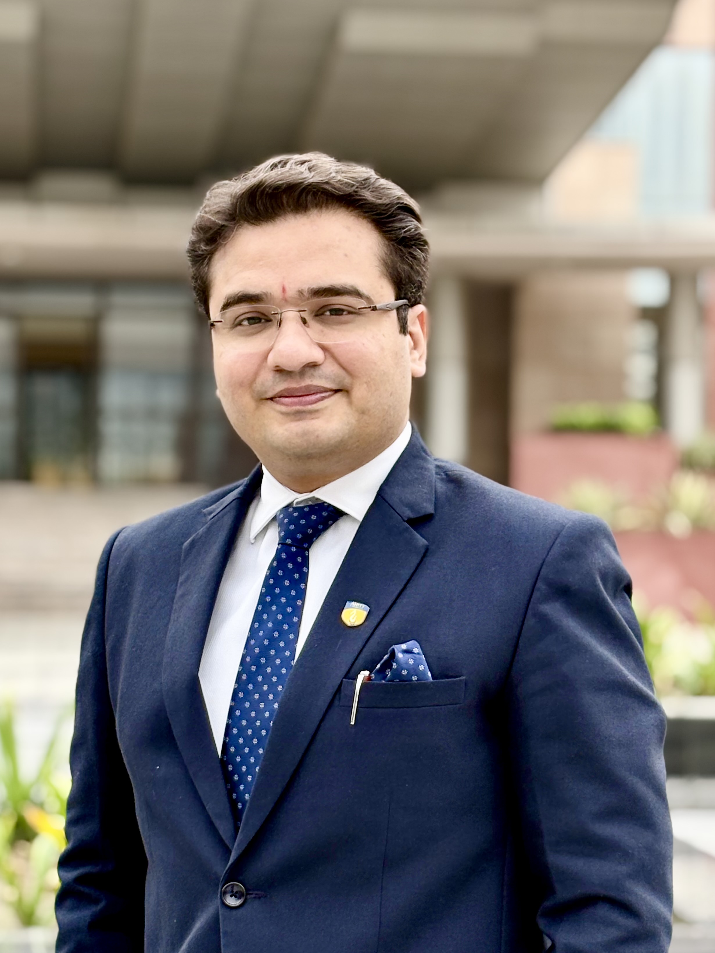 Dr. Anjani Kumar Bhatnagar at his office desk, Amity Education Group